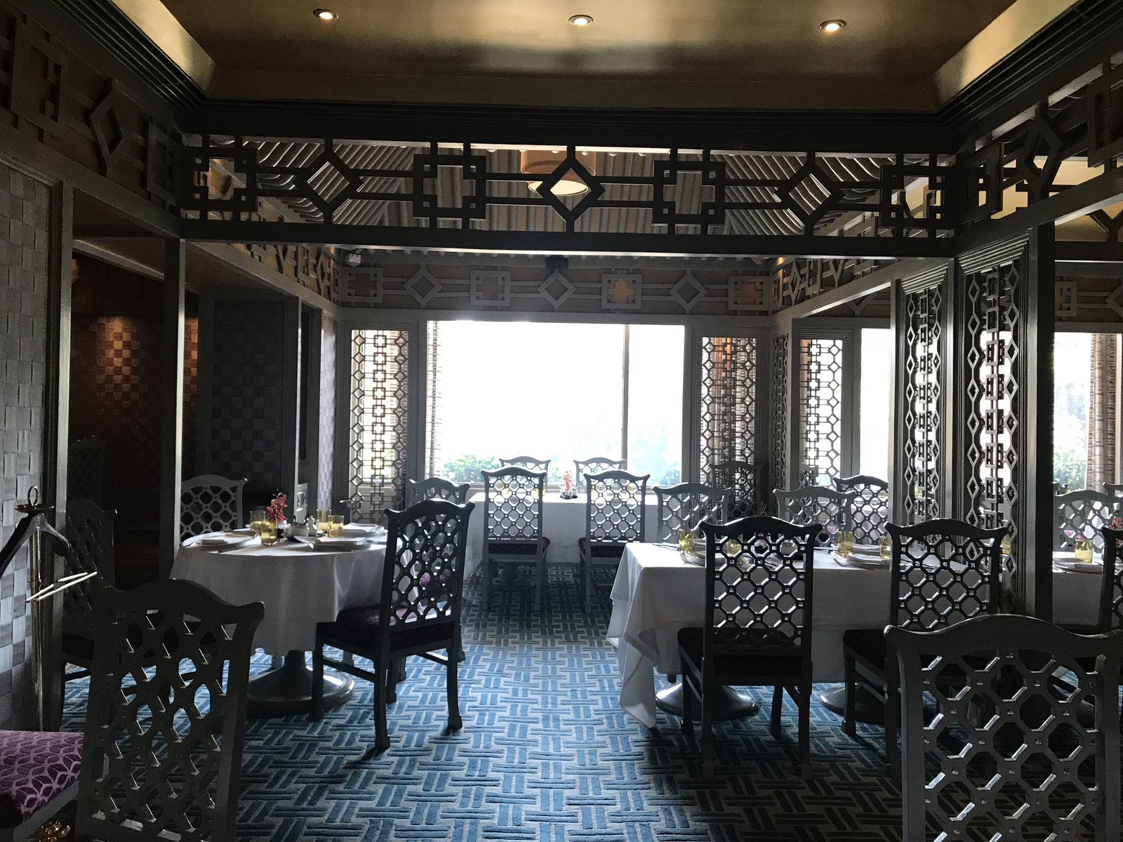 House of Ming — lattice screens, blue carpet and panoramic window