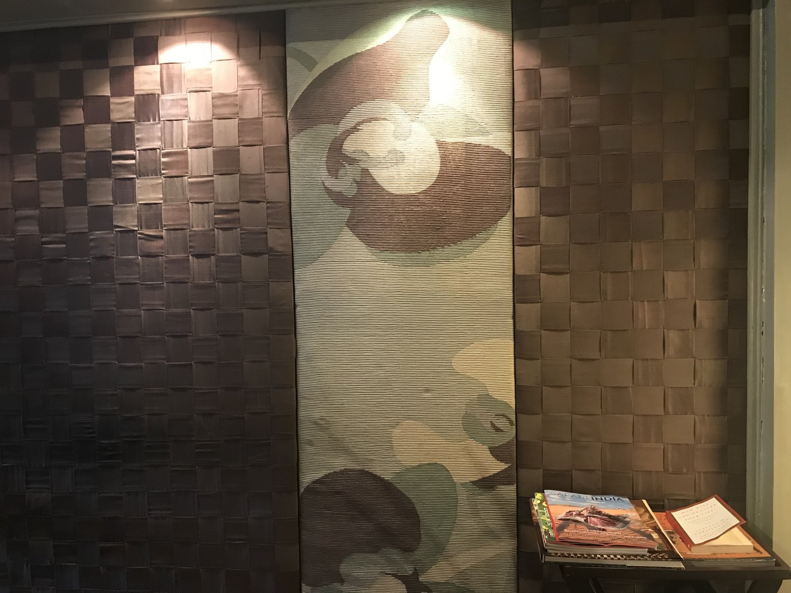 Installed — woven wall panels and relief detail