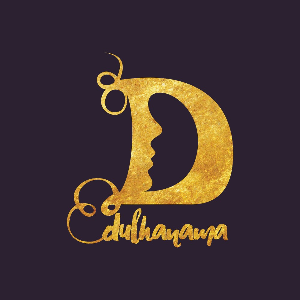 The Dulhanama lettermark in gold on a deep aubergine ground