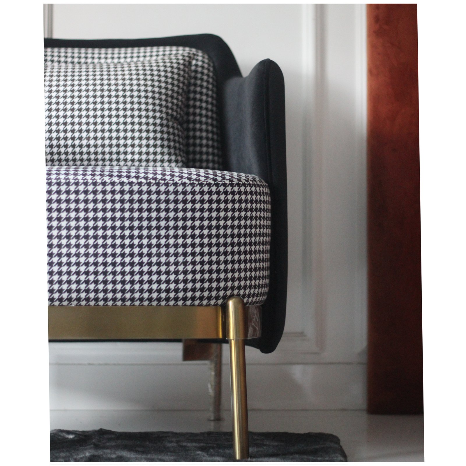 Detail — houndstooth seat, brass base and leg