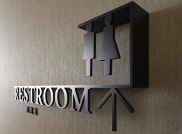 Laser-cut restroom wayfinding